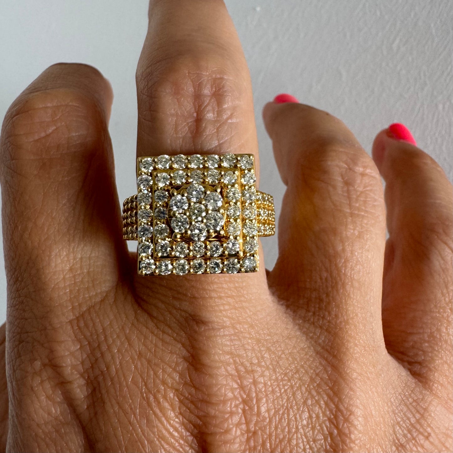 10K gold ring featuring a bold geometric design beautifully set with sparkling Diamonds