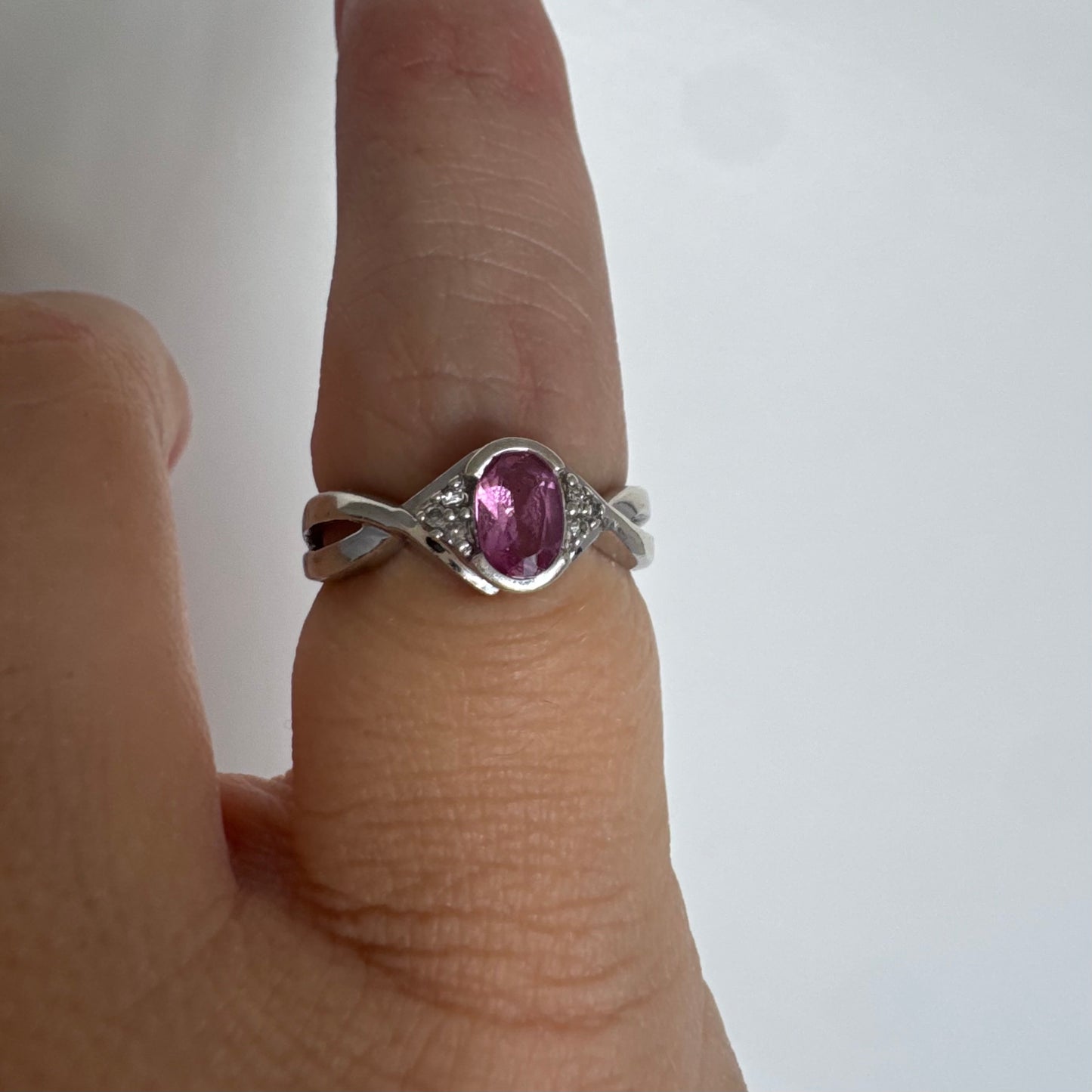 9K gold ring set with a pink center stone