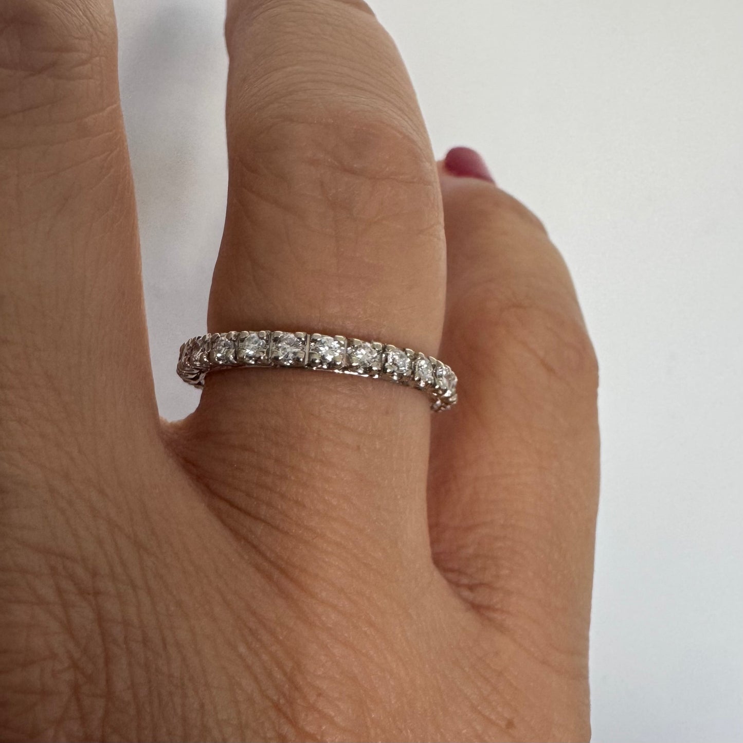 Classic 14K gold eternity ring set with a full circle of sparkling Diamonds