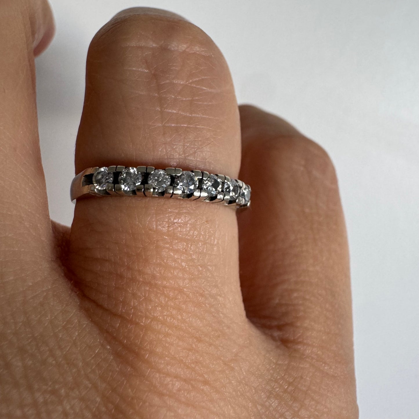 14K gold half eternity ring set with sparkling Diamonds.