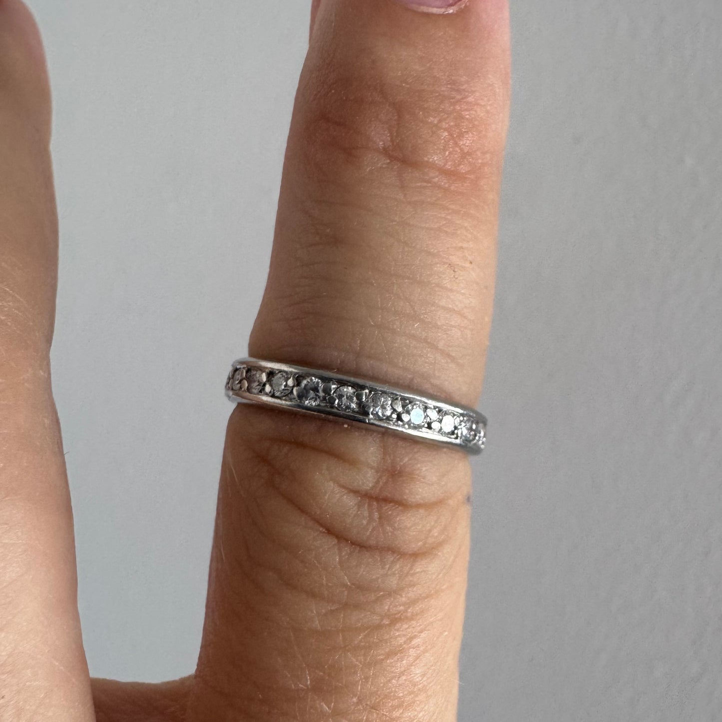 14K white gold eternity ring set with a row of sparkling Diamonds
