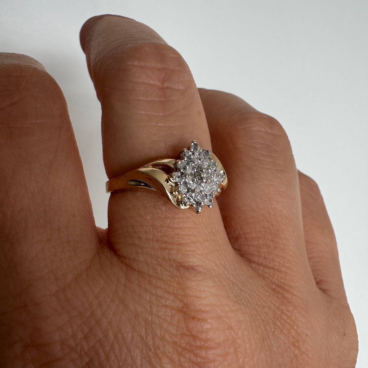 10K gold ring set with Diamonds, featuring a classic design with soft, flowing curves.