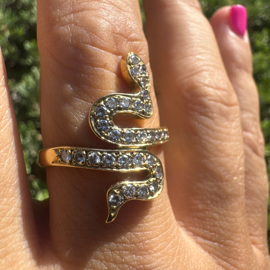 18K gold snake ring adorned with sparkling Diamonds, elegantly wrapping around the finger.