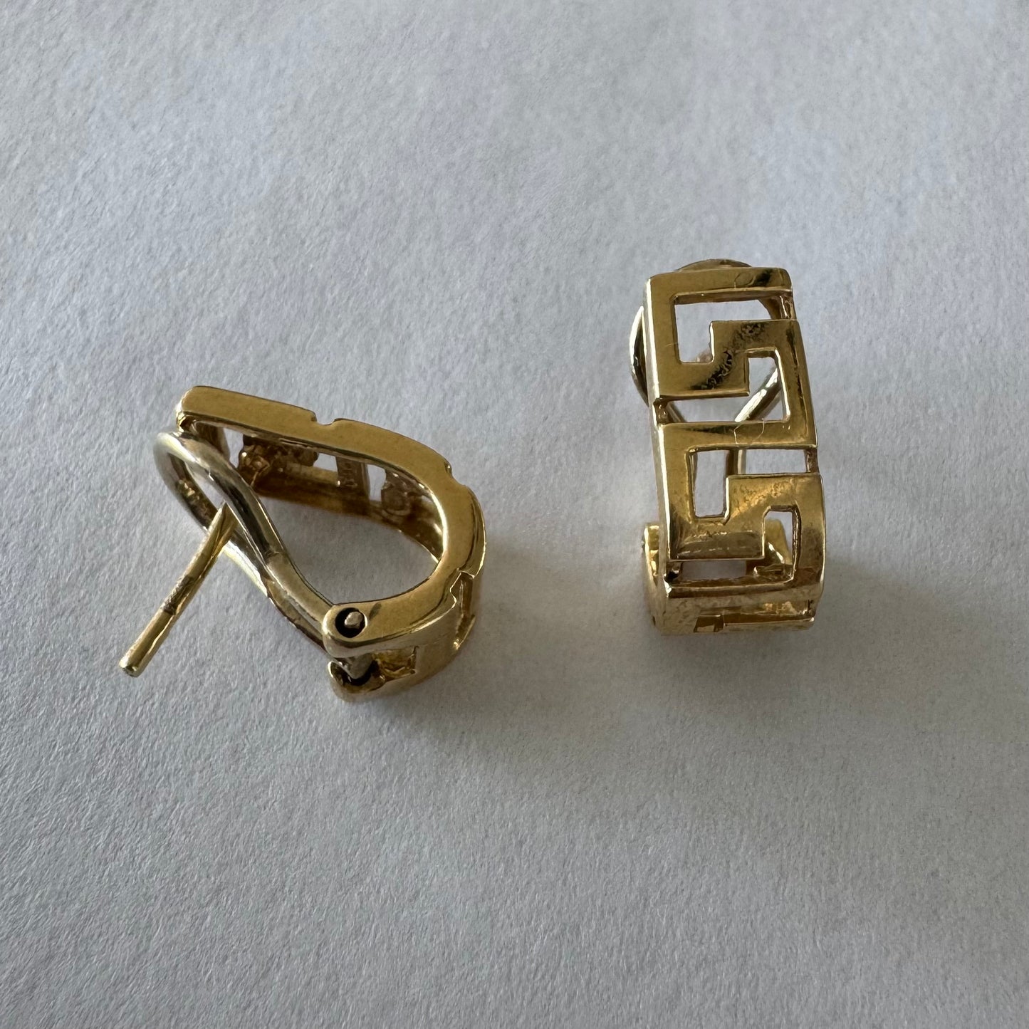 14K gold earrings featuring a geometric design