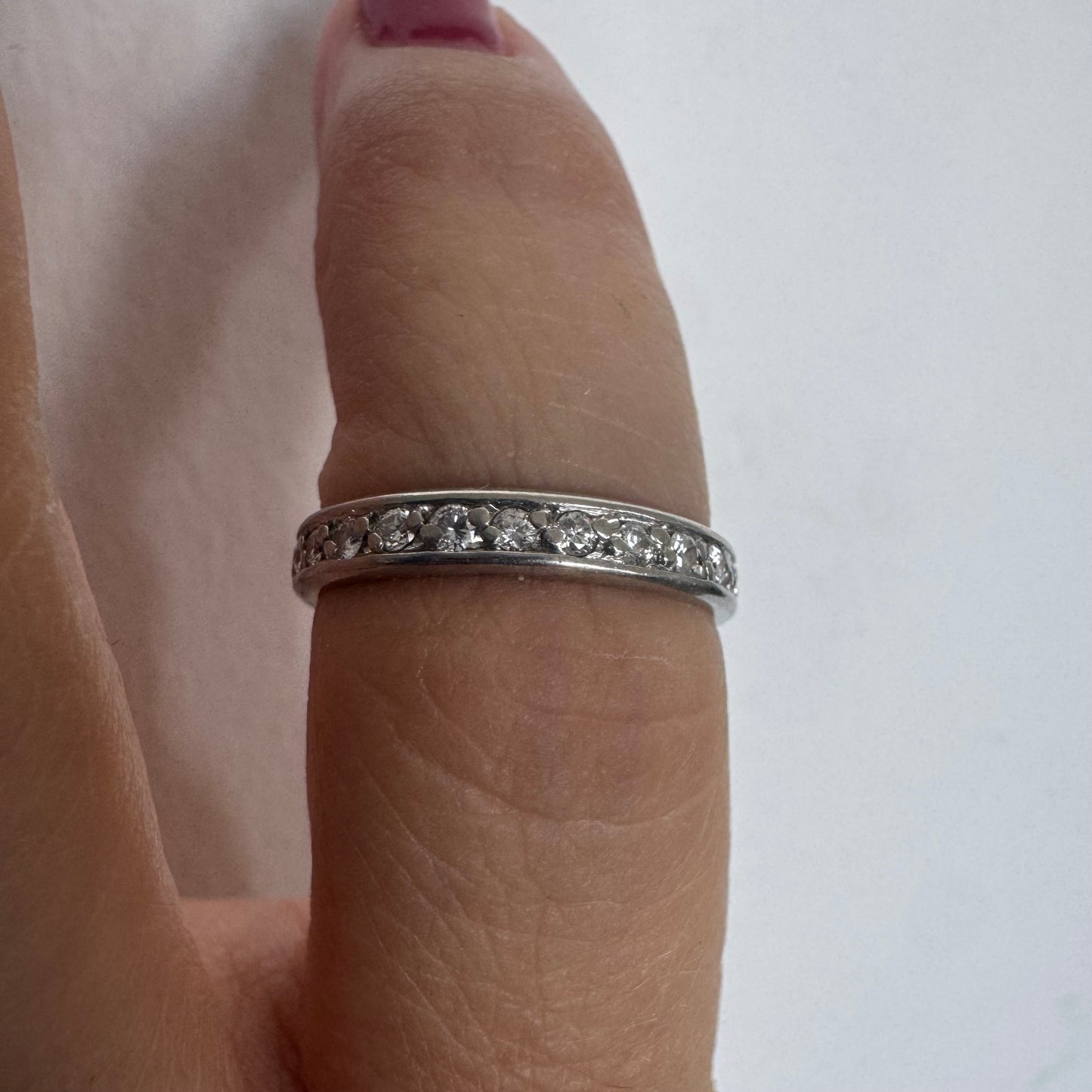 14K white gold eternity ring set with a row of sparkling Diamonds