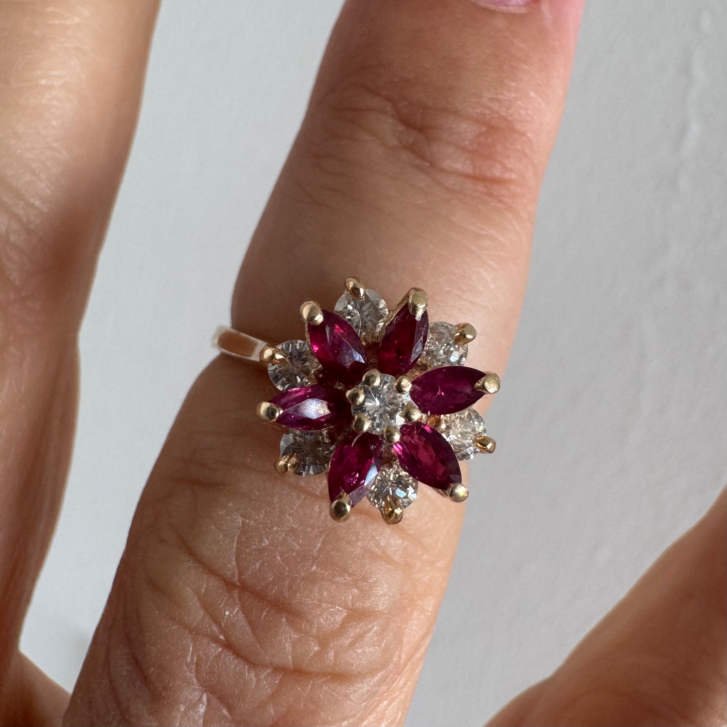 14K gold ring featuring a classic floral-inspired design set with marquise-cut Rubies & Diamonds.