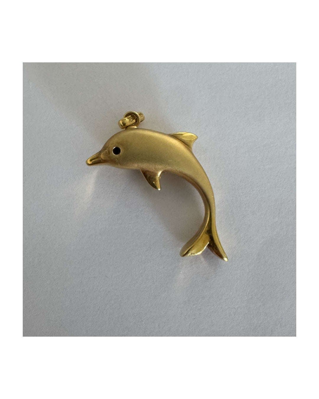 14K gold dolphin pendant with a smooth & polished finish.
