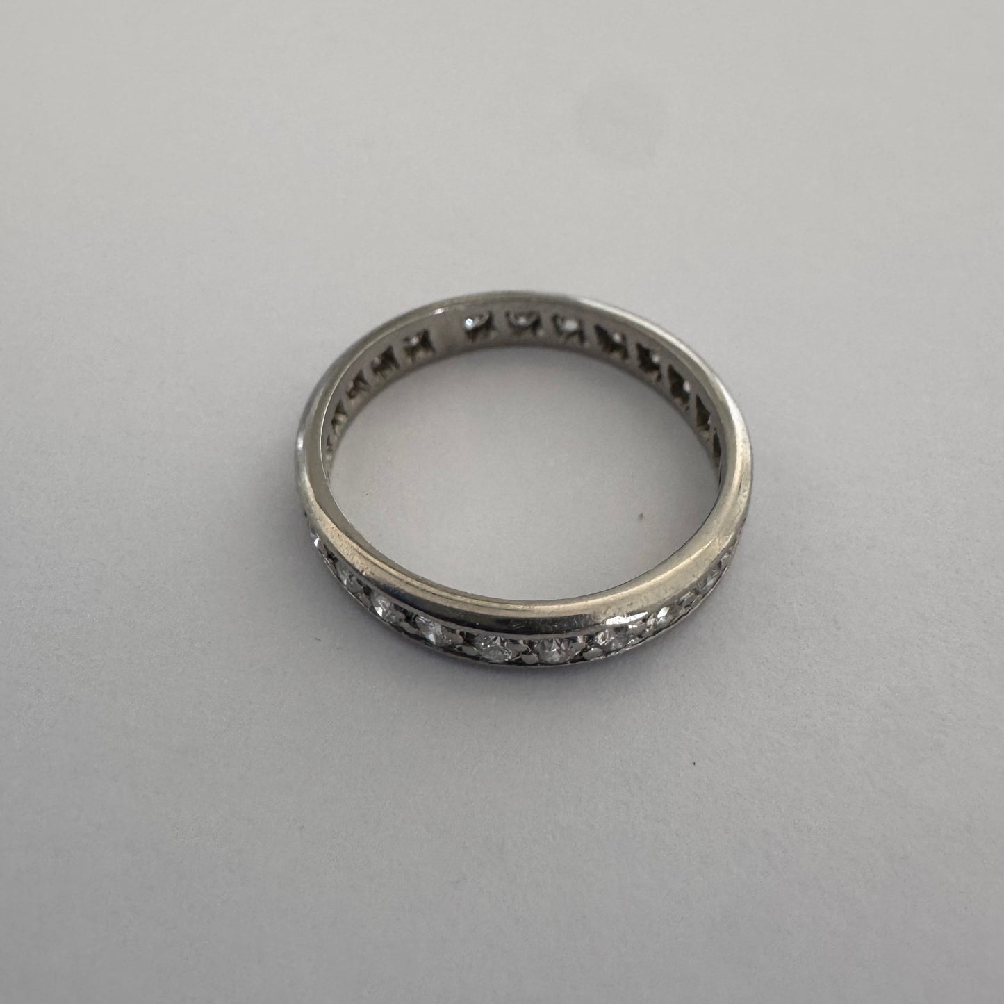 14K white gold eternity ring set with a row of sparkling Diamonds