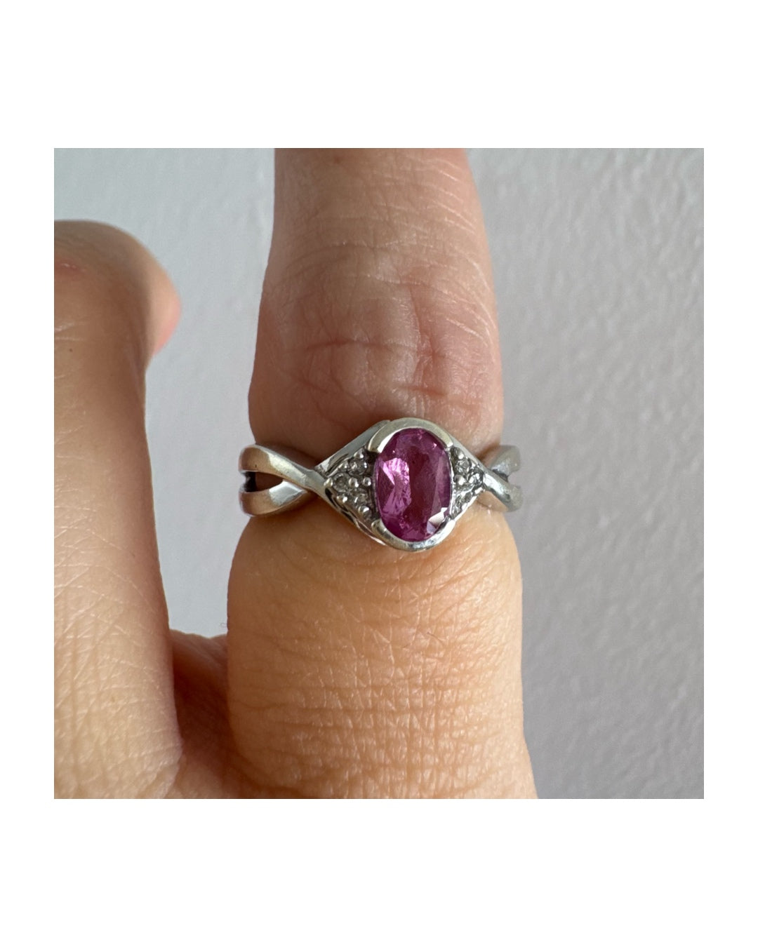 9K gold ring set with a pink center stone