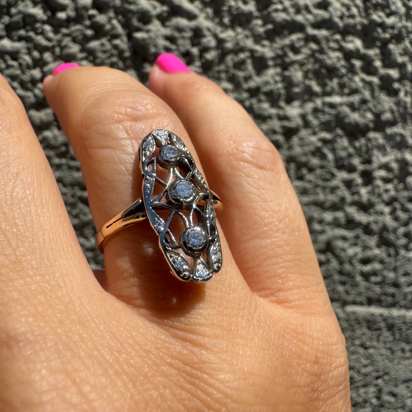 14K gold ring set with diamonds in an elongated openwork design