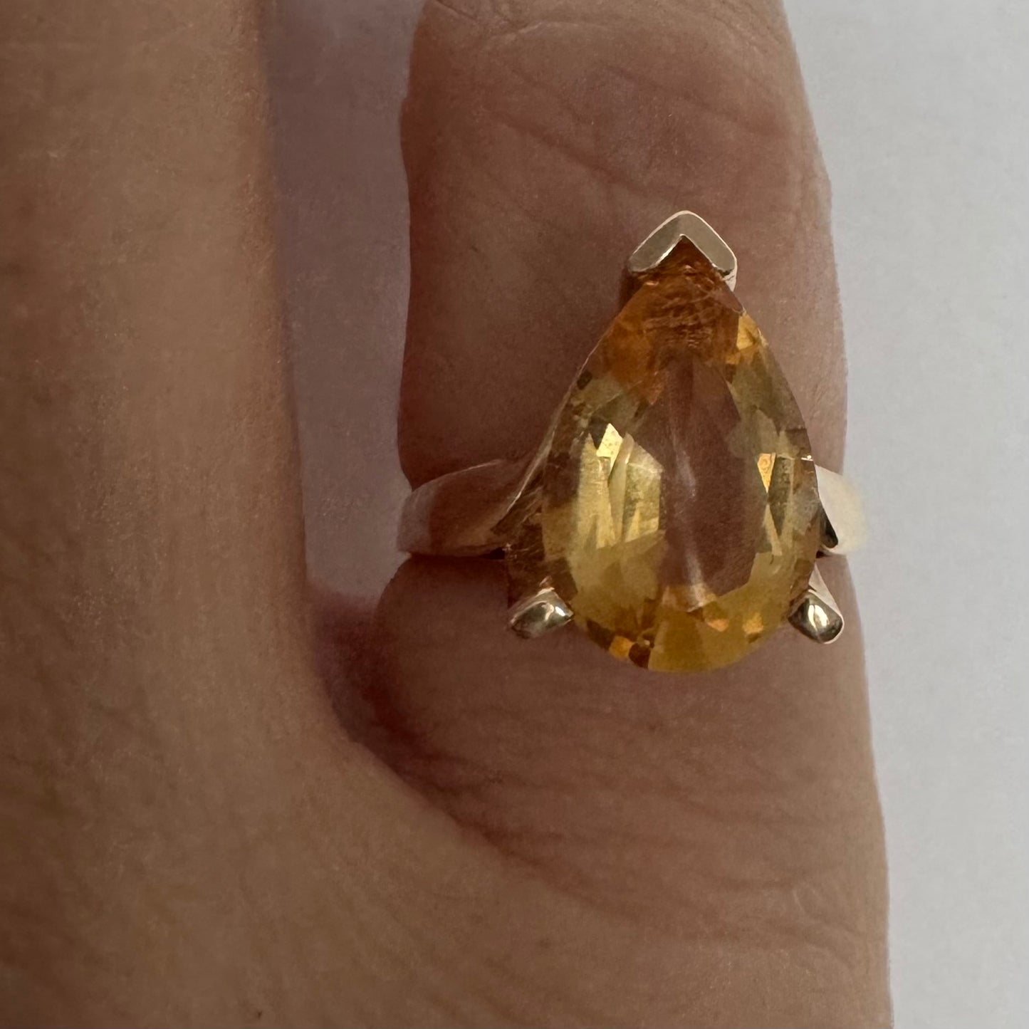 14K gold ring set with a large pear-shaped Citrine