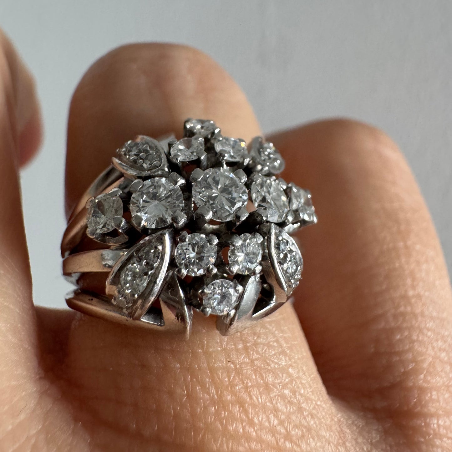 Platinum ring set with Diamonds in a bold, multi-layered floral design.