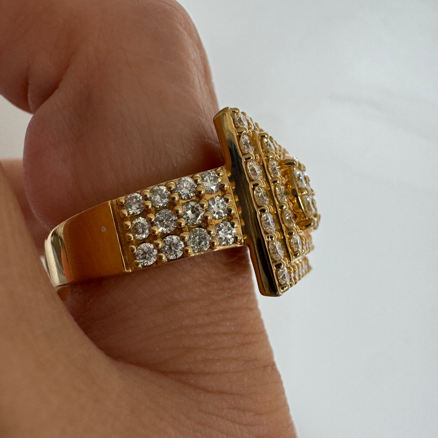 10K gold ring featuring a bold geometric design beautifully set with sparkling Diamonds