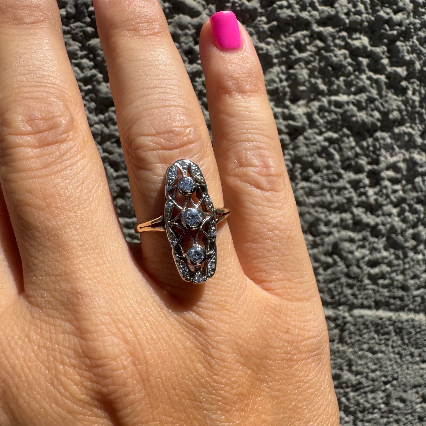 14K gold ring set with diamonds in an elongated openwork design