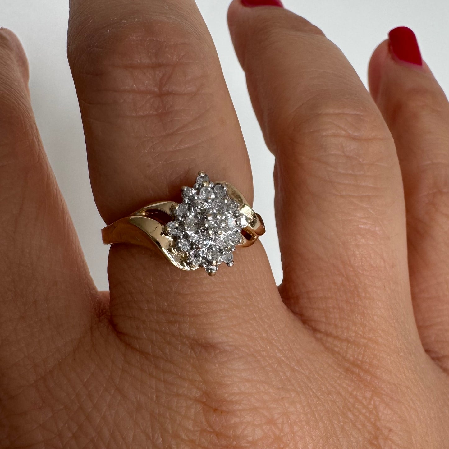 10K gold ring set with Diamonds, featuring a classic design with soft, flowing curves.
