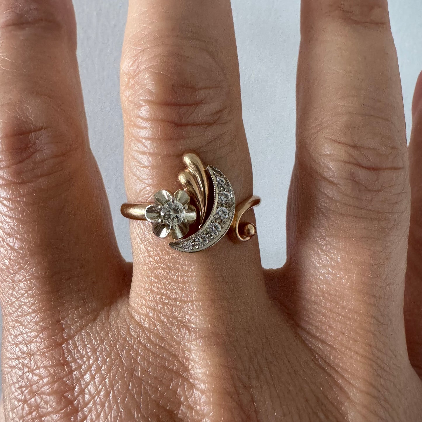 14K gold ring with a delicate moon and star motif set with Diamonds