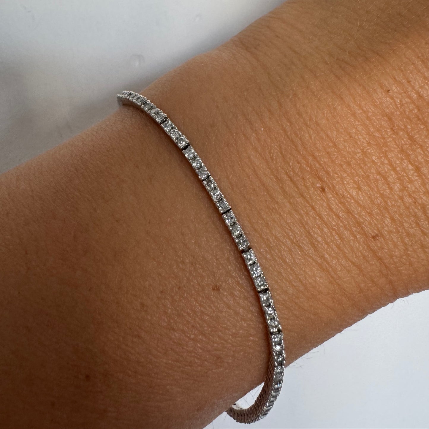 14K gold diamond bracelet with a sleek & elegant design.