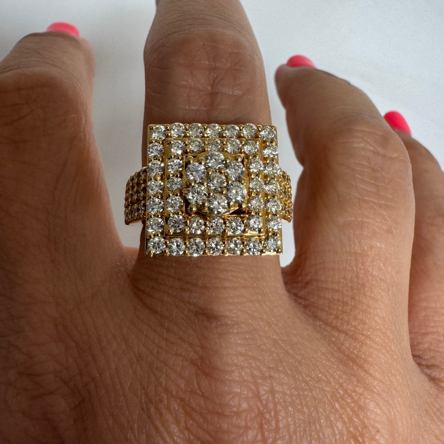 10K gold ring featuring a bold geometric design beautifully set with sparkling Diamonds