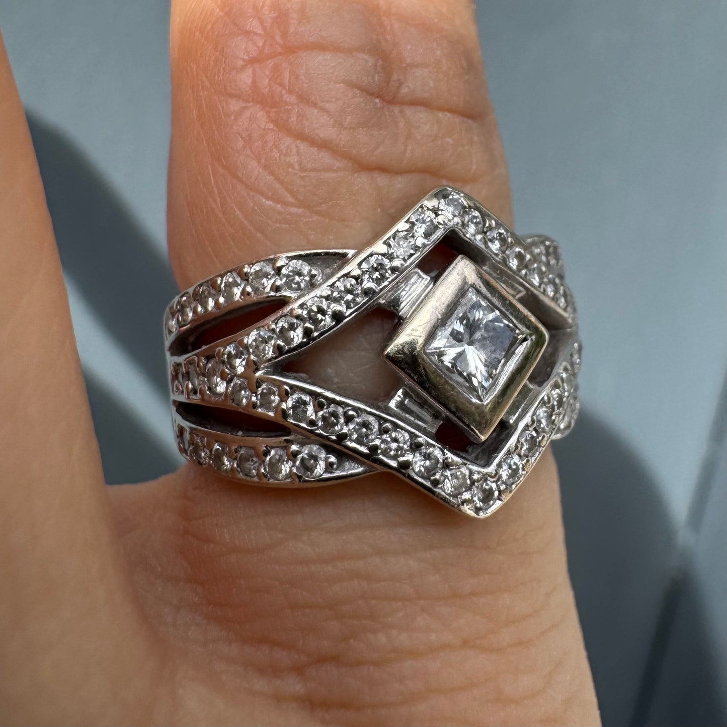 14K gold diamond ring featuring a luxurious geometric Art-Deco inspired design.