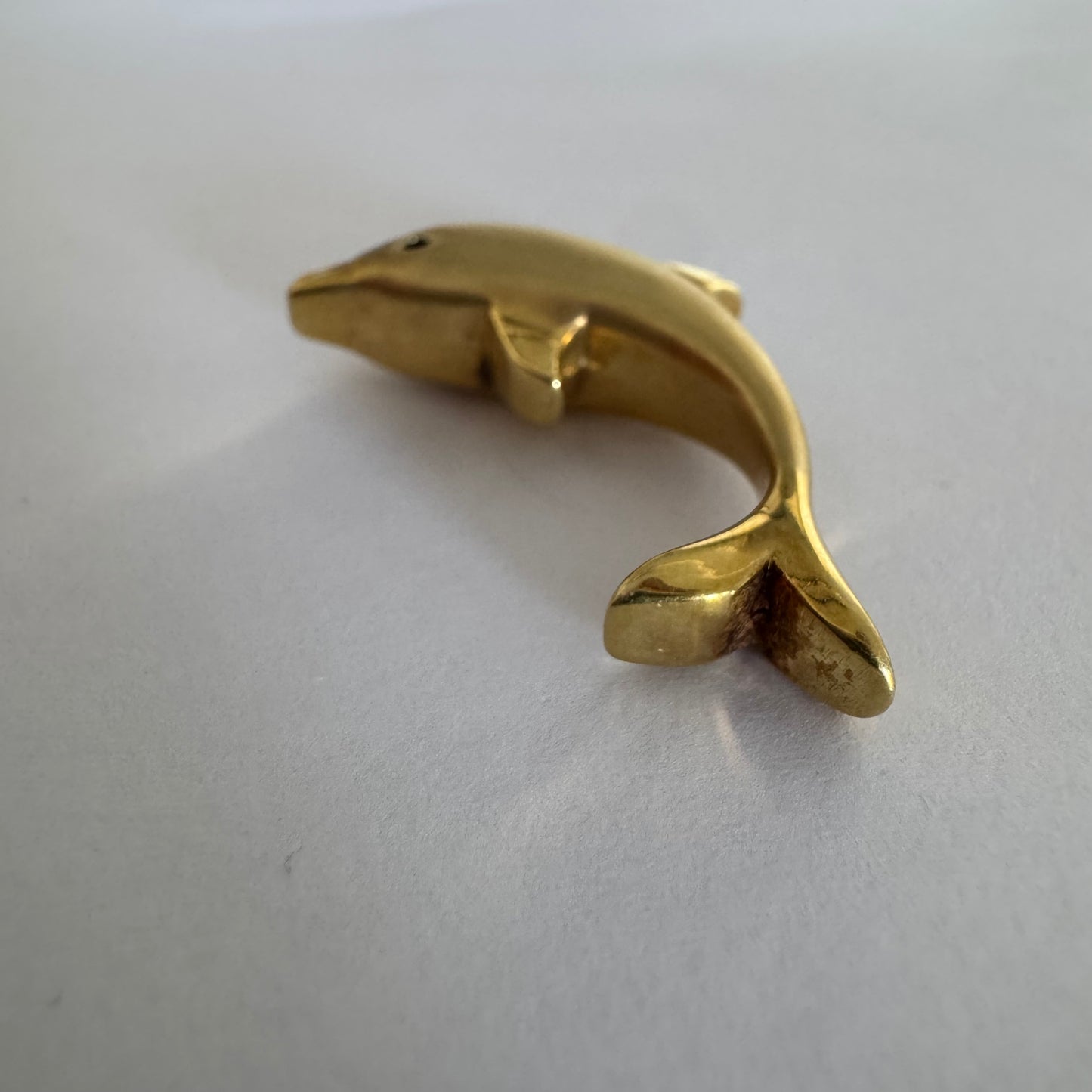 14K gold dolphin pendant with a smooth & polished finish.