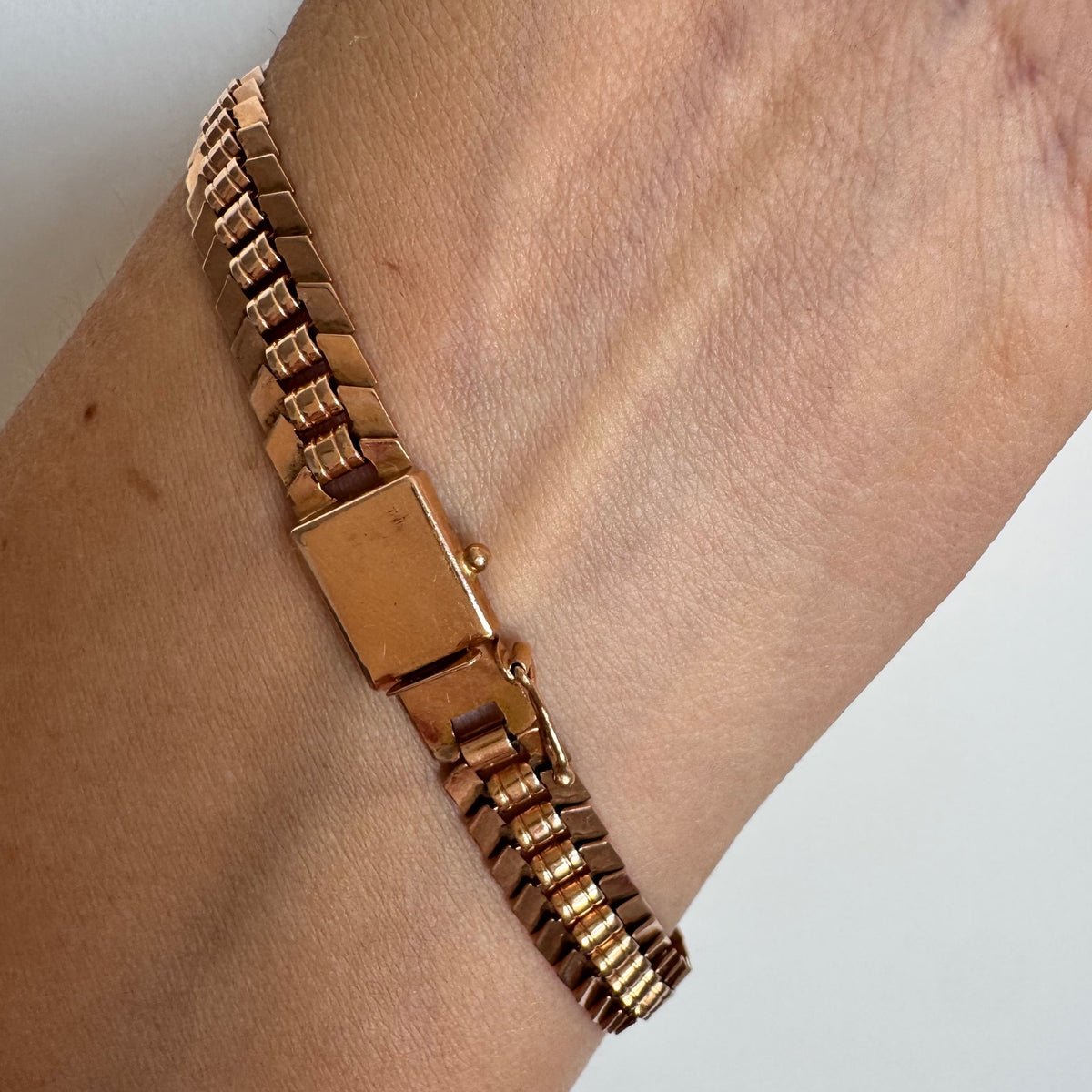 14K gold bracelet with a bold, flexible link design and a secure box clasp.