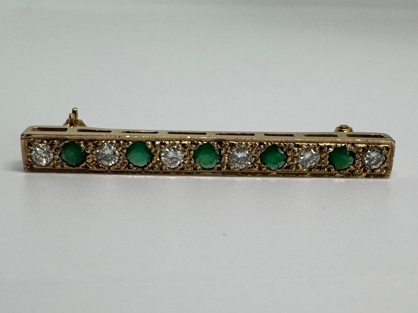 14K gold pin set with Emerald & Diamonds