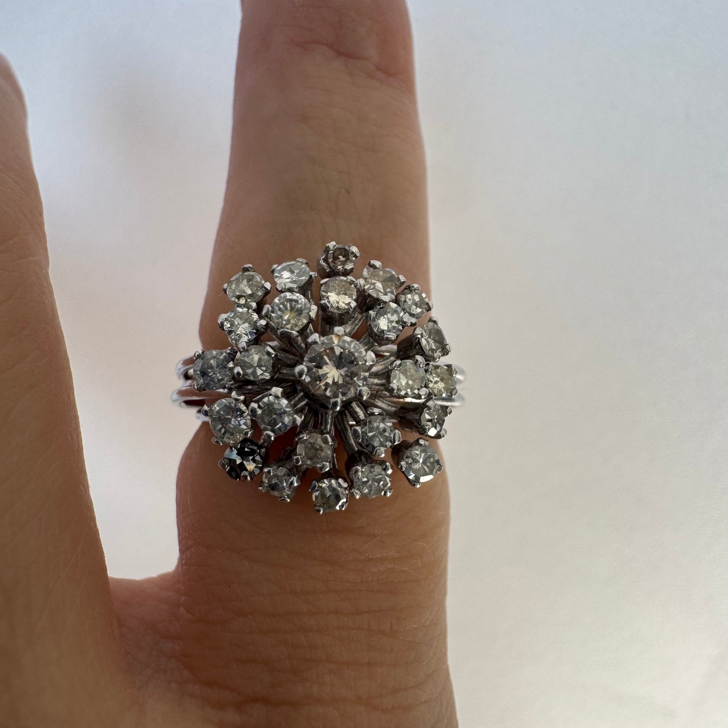 14K gold ring set with a cluster of sparkling Diamonds in a rich floral-inspired design.