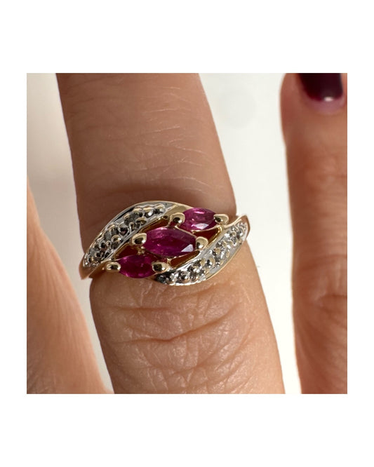 14K gold ring combining yellow and white gold, set with marquise-cut Rubies