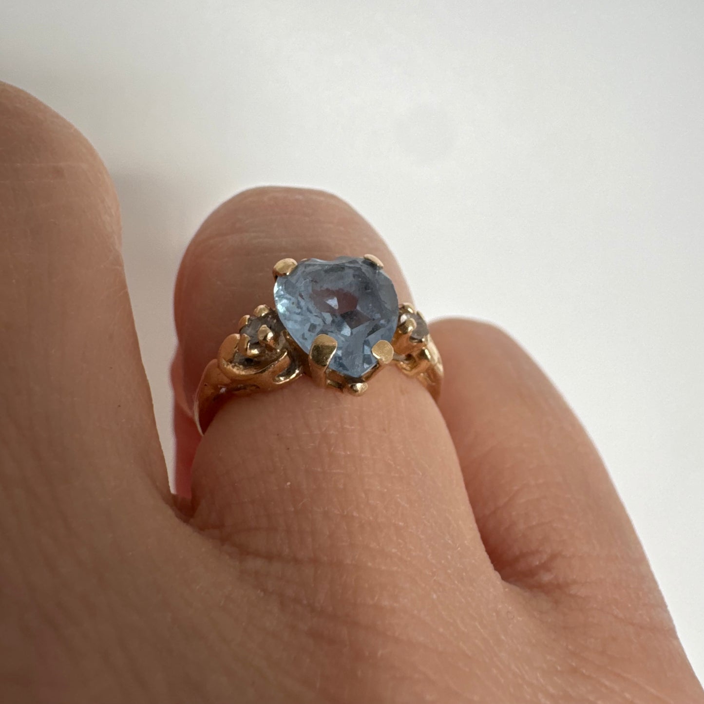14K gold ring set with a heart-cut Blue Topaz stone