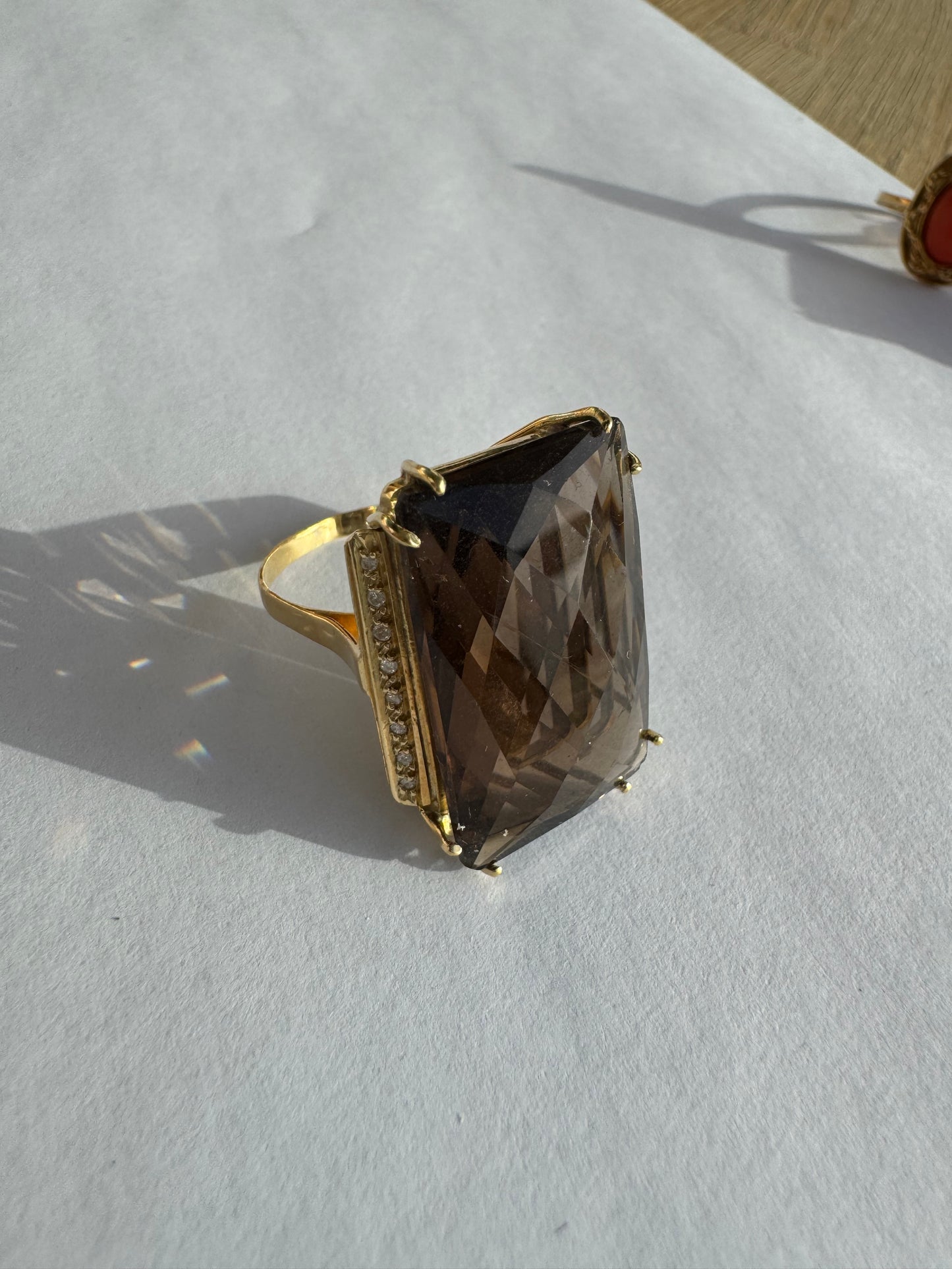 18K gold statement ring set with an oversized rectangular faceted Smoky Quartz center stone & Diamonds