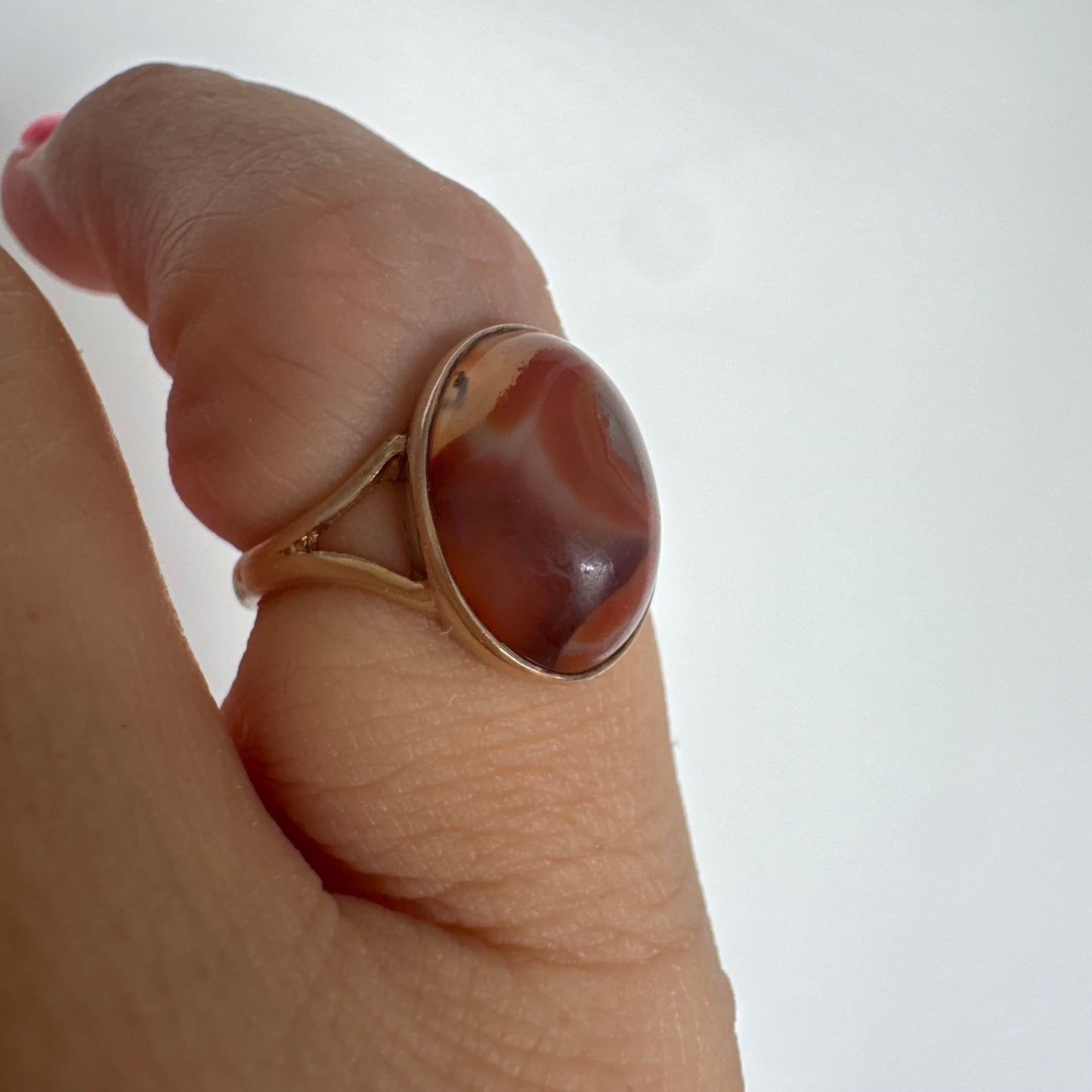 9K gold ring set with a warm reddish-brown stone featuring beautiful natural patterns