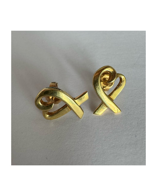 עגילי זהב צהוב 18 קראט, בעיצובה של Paloma Picasso עבור טיפאני אנד קו.