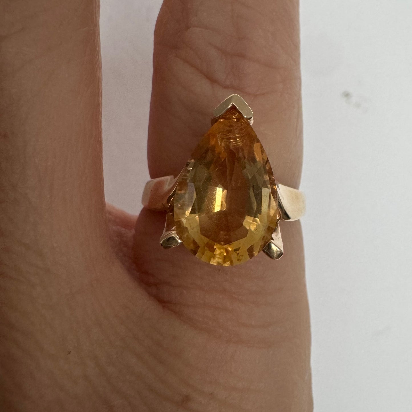 14K gold ring set with a large pear-shaped Citrine