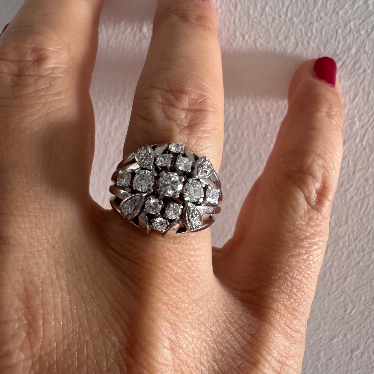 Platinum ring set with Diamonds in a bold, multi-layered floral design.