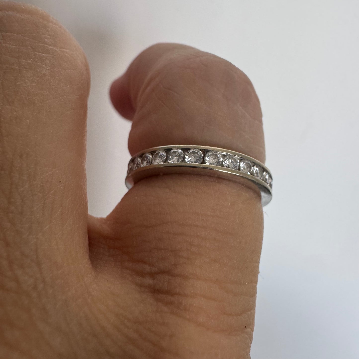 14K white gold eternity ring set with a row of sparkling Diamonds