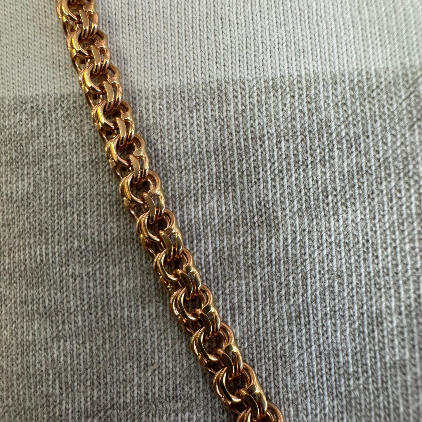 14K gold chain featuring an intricate woven link