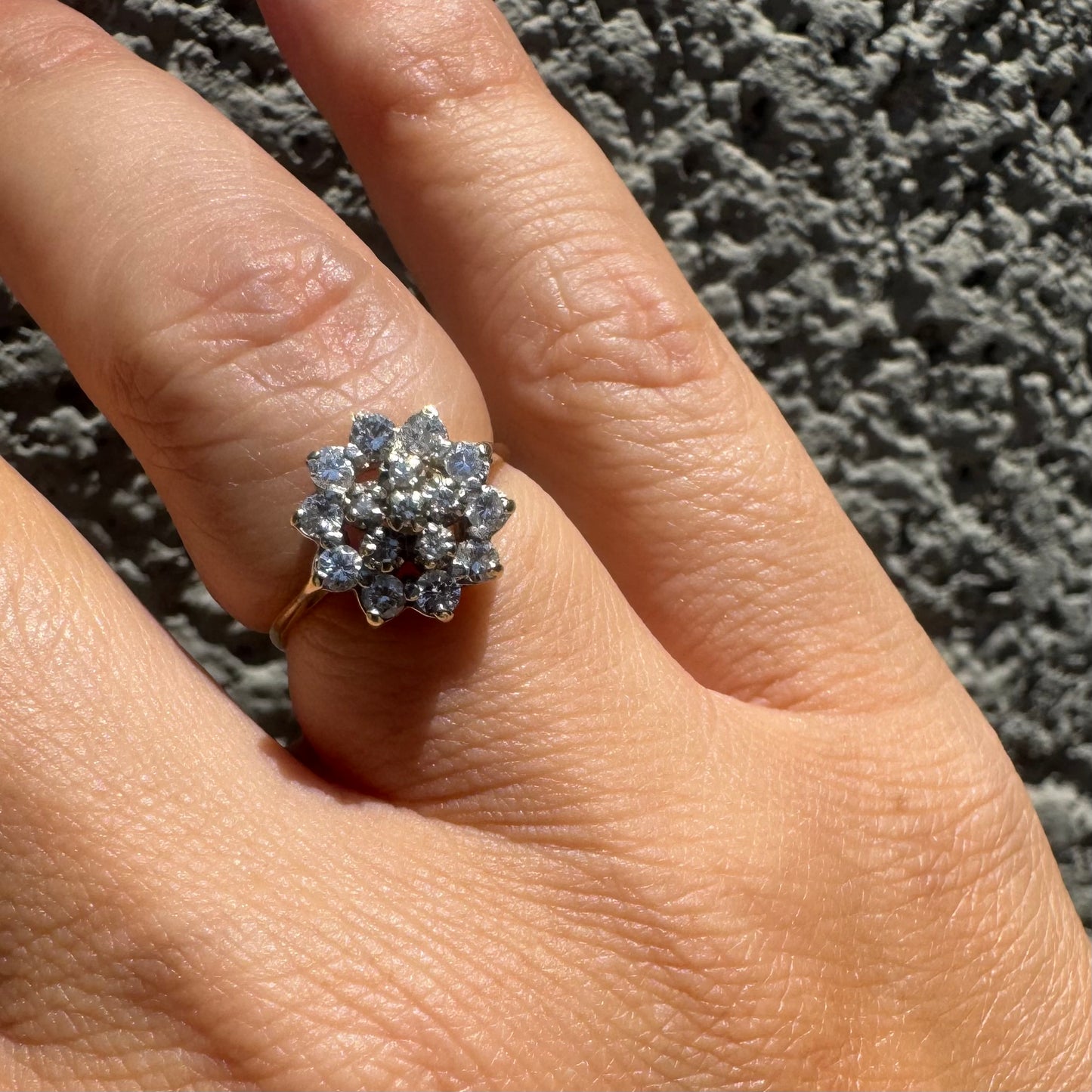 14K gold floral ring set with a dazzling double halo of sparkling Diamonds arranged in a blooming design