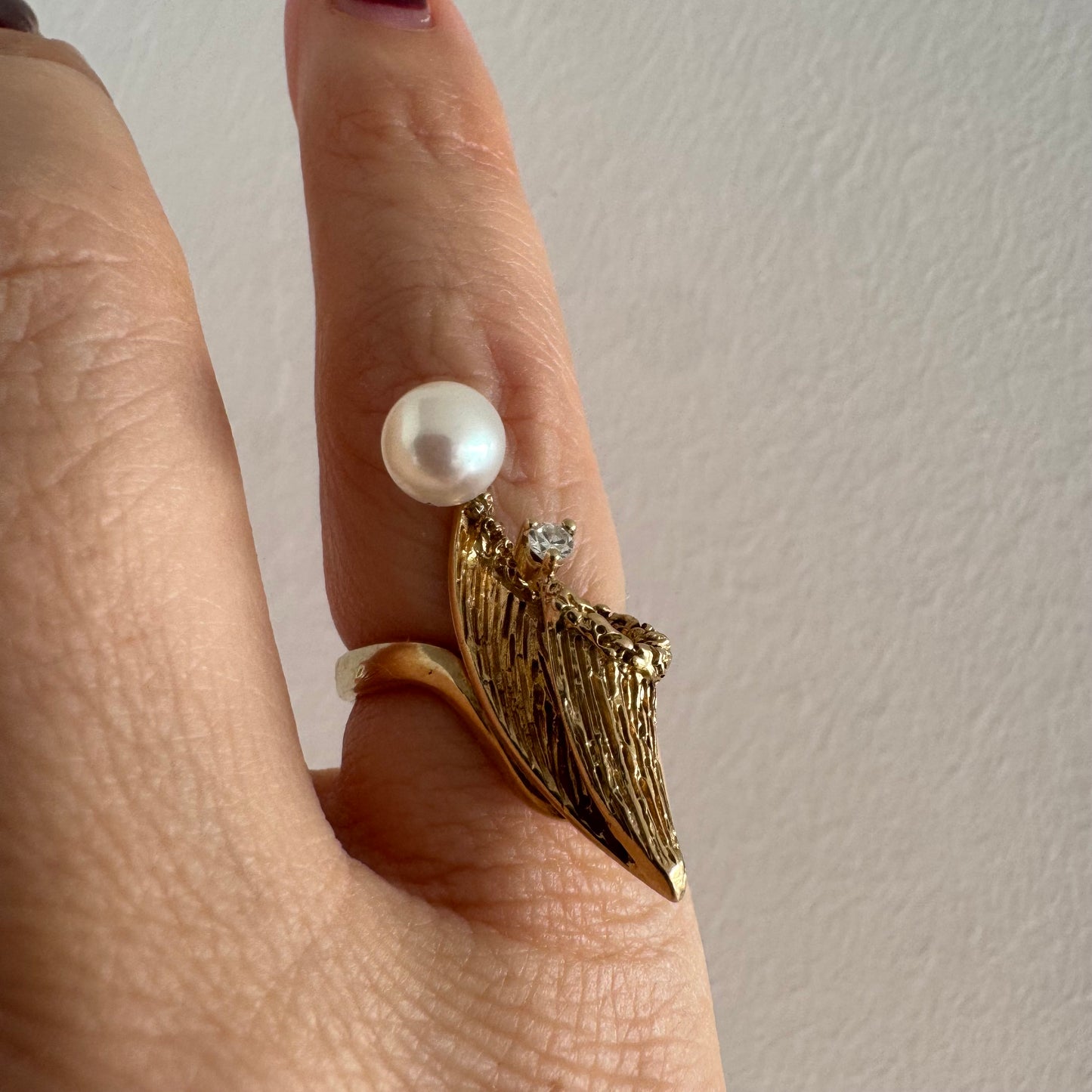 14K gold sculptural ring set with a round Pearl and a delicate Diamond