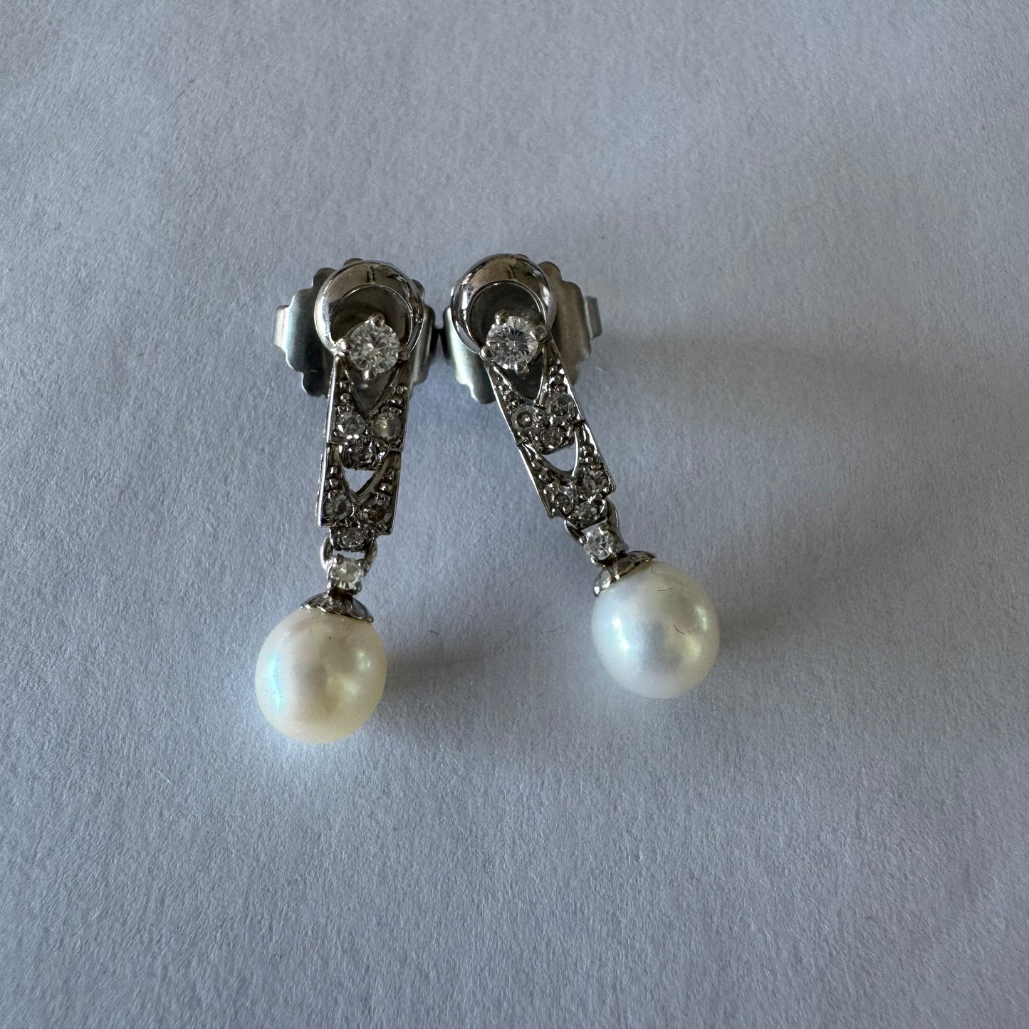 14K gold drop earrings set with Diamonds and a dangling Pearl.