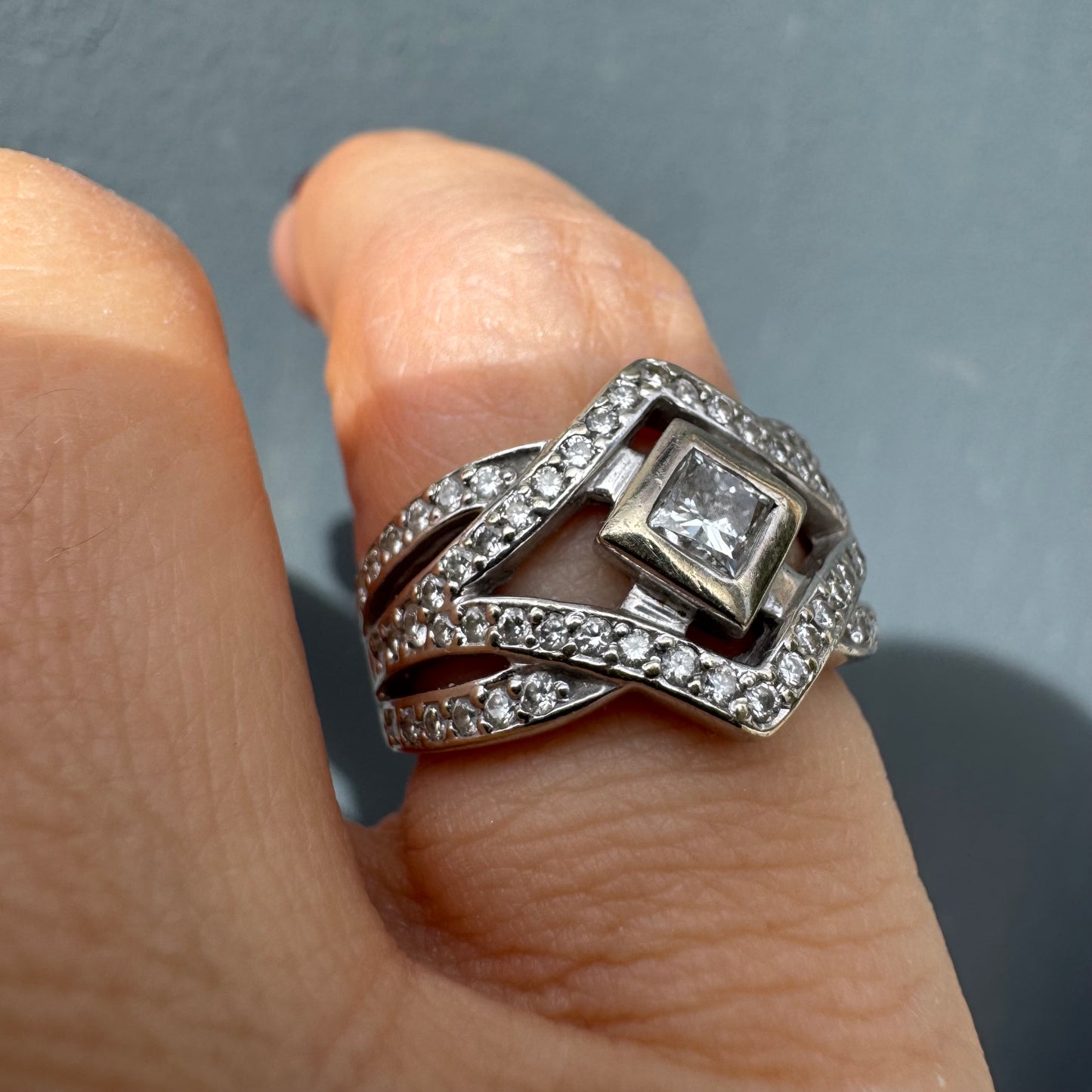 14K gold diamond ring featuring a luxurious geometric Art-Deco inspired design.