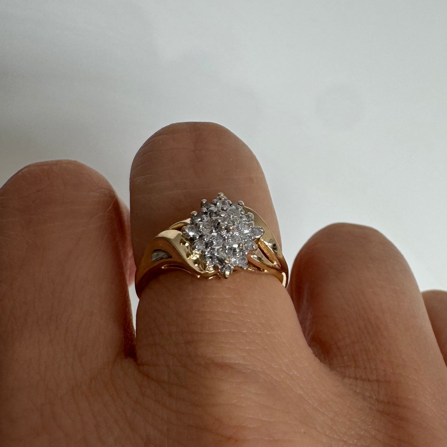 10K gold ring set with Diamonds, featuring a classic design with soft, flowing curves.