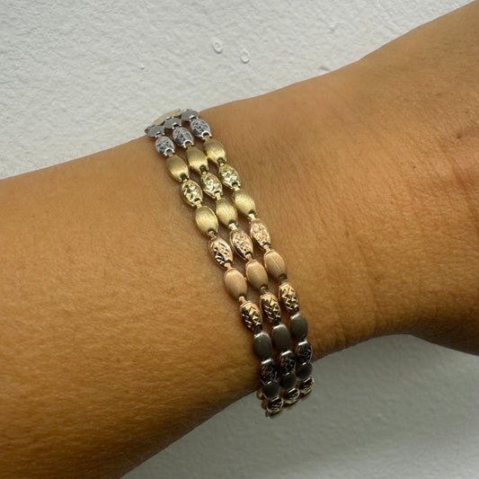 14K tri-color gold bracelet featuring yellow, white and rose gold links