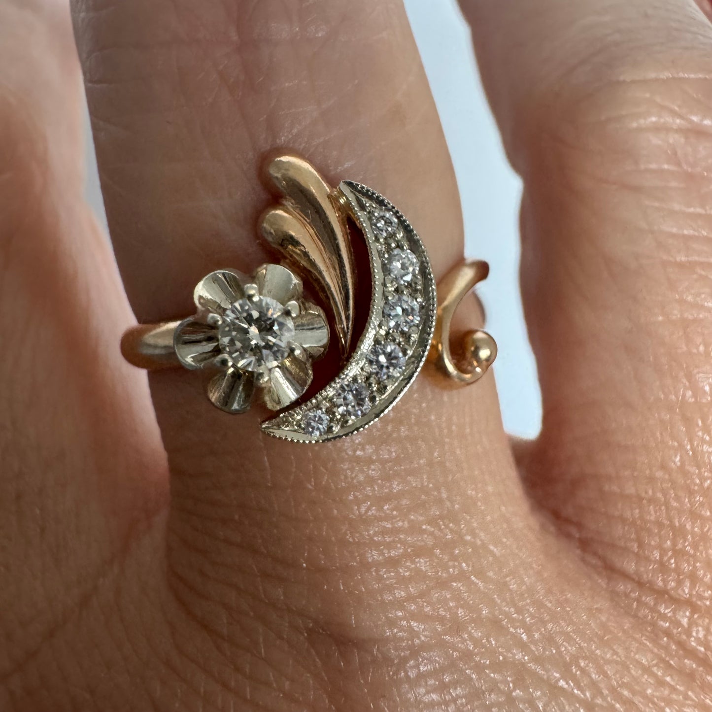 14K gold ring with a delicate moon and star motif set with Diamonds