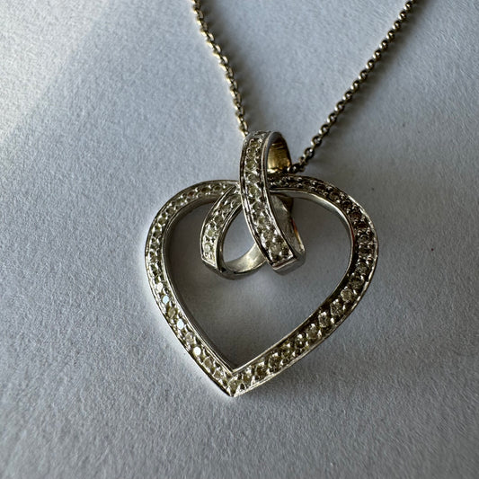 14K gold necklace and heart pendant set with sparkling Diamonds.