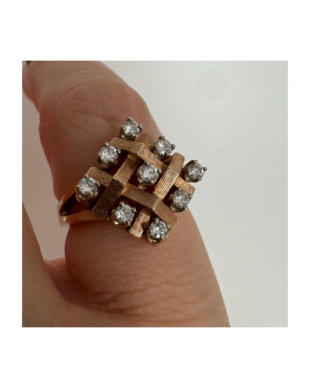 14K gold woven-style ring set with round Diamonds in a symmetrical layout.