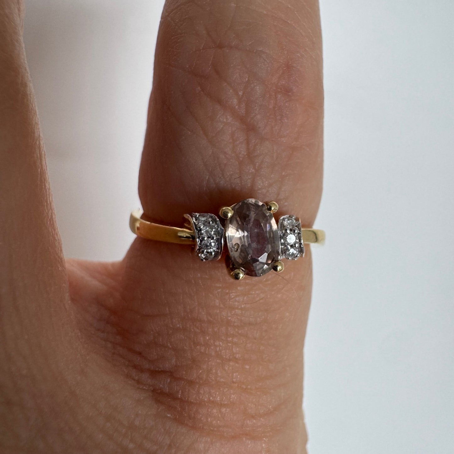 18K gold ring featuring a captivating oval Smoky Quartz & side Diamonds