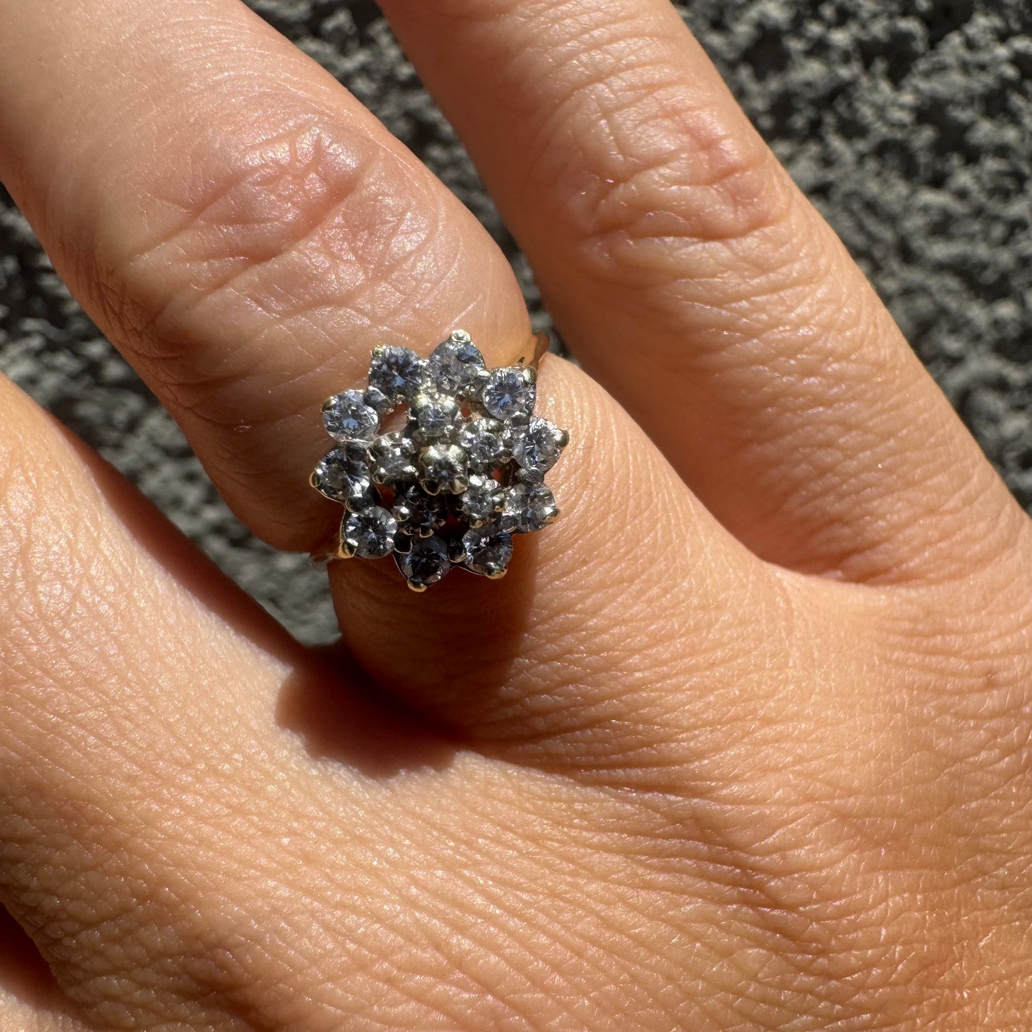 14K gold floral ring set with a dazzling double halo of sparkling Diamonds arranged in a blooming design