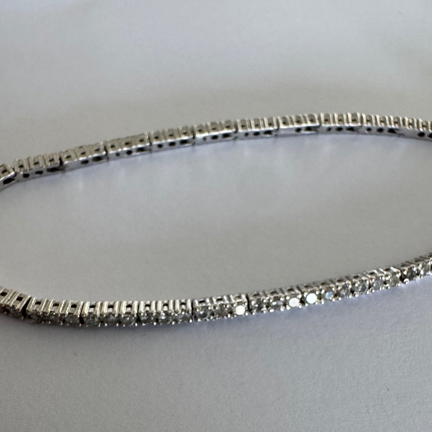 14K gold diamond bracelet with a sleek & elegant design.