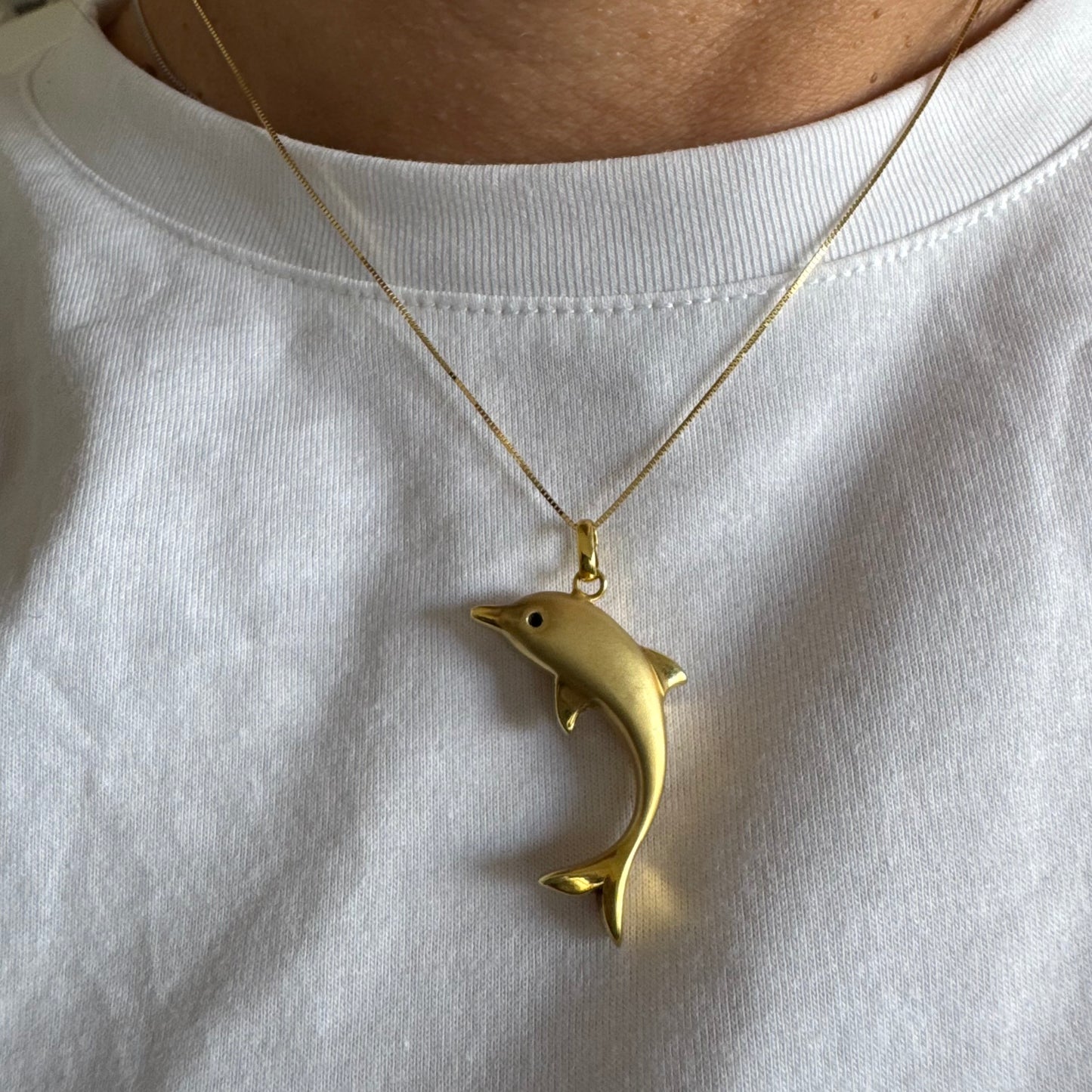 14K gold dolphin pendant with a smooth & polished finish.