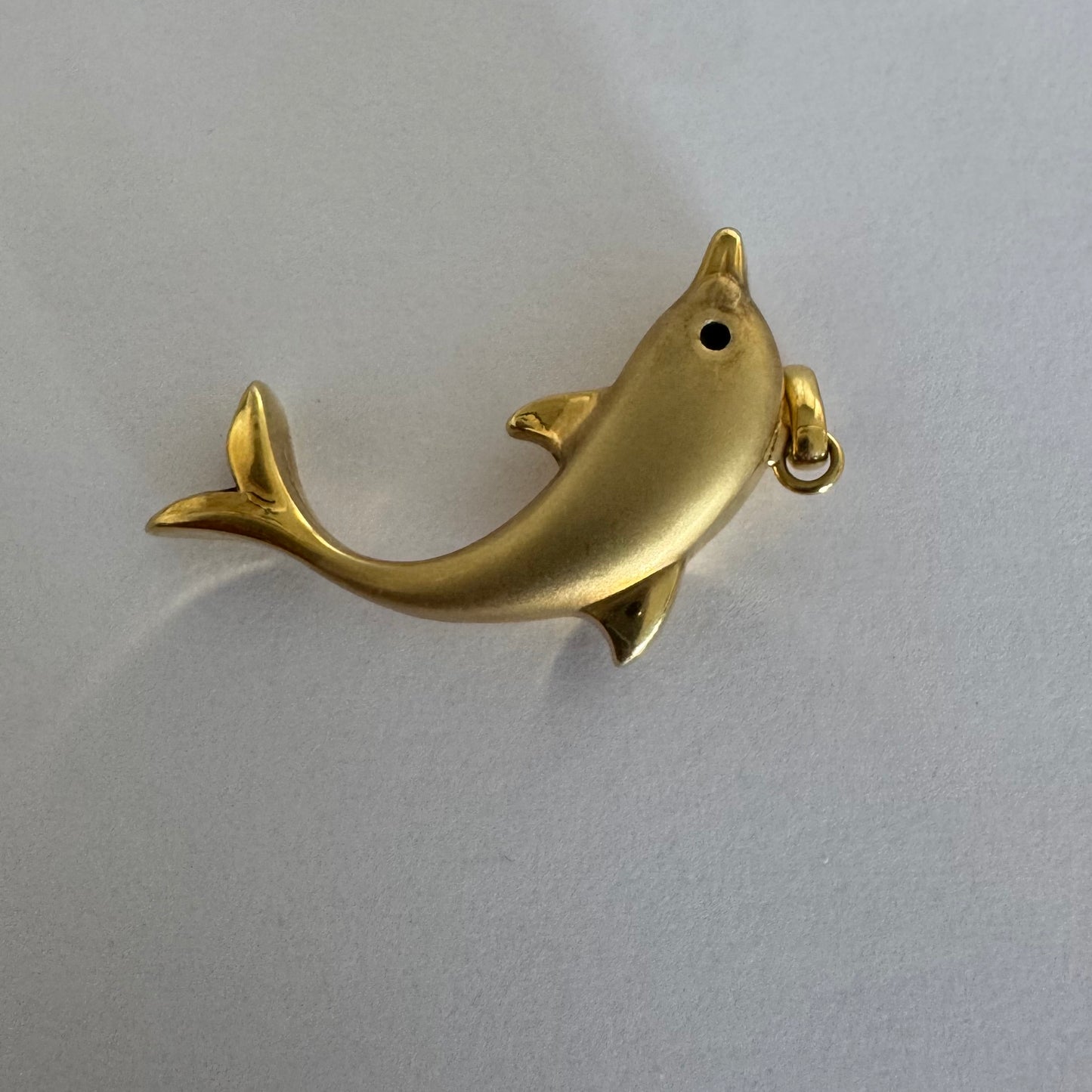 14K gold dolphin pendant with a smooth & polished finish.